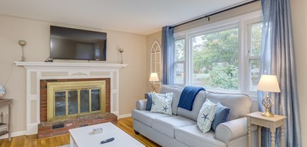 South Yarmouth Cape Cod vacation rental - Living room with view of the fireplace and couch