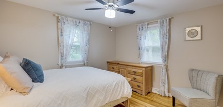 South Yarmouth Cape Cod vacation rental - 2nd bedroom, view of dresser and additional seating.