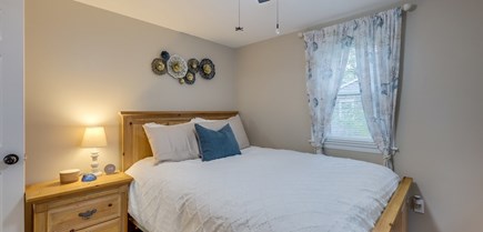 South Yarmouth Cape Cod vacation rental - 2nd Bedroom, one queen-sized bed, dresser and end table.