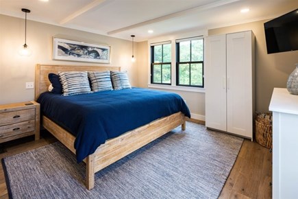 Truro Cape Cod vacation rental - Primary bedroom, night stand, closet, dresser