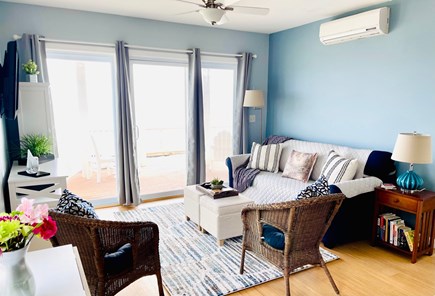 North Truro Cape Cod vacation rental - Living room with beautiful water views and walk-out to the deck.