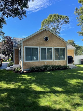 South Yarmouth Cape Cod vacation rental - Back of new addition with outdoor shower and grill on the right.