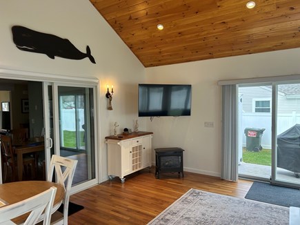 South Yarmouth Cape Cod vacation rental - Three Season room TV and slider to shower and grill.