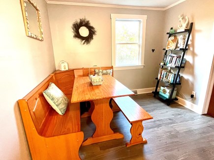 East Falmouth Cape Cod vacation rental - Kitchen table and share a book area