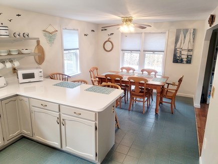 Harwich Cape Cod vacation rental - Dining room table seats 6 with three more kitchen counter stools