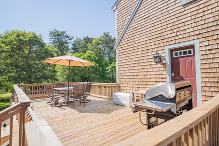 Harwich Cape Cod vacation rental - Huge deck overlooking pool with gas grill and dining set.