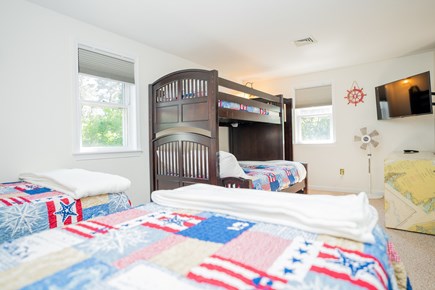 Harwich Cape Cod vacation rental - Crew's Quarters - 2 twins, twin-over-full bunk bed, and 42 in tv.