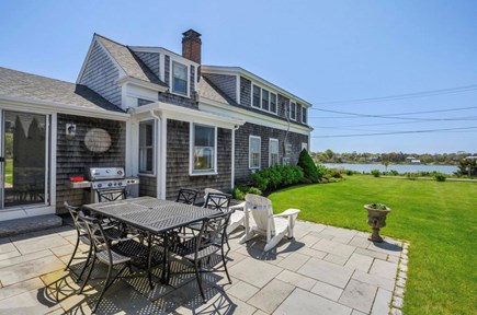 Chatham Cape Cod vacation rental - Patio with BBQ grill overlooking water at Sea Captain's House