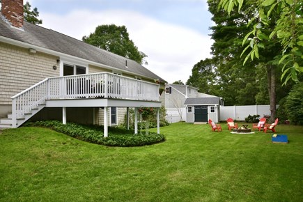 Osterville Woods Cape Cod vacation rental - Spacious back yard with deck, grill & firepit