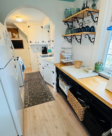 West Yarmouth Cape Cod vacation rental - A view of the delightful galley style kitchen with washer / dryer