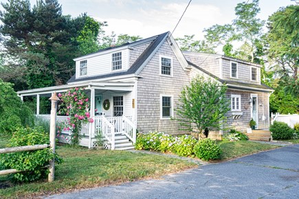 Dennis Port Cape Cod vacation rental - Front of house. Porch to watch sunrise. Driveway for 4 cars.