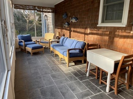 Dennis, Corporation Beach Cape Cod vacation rental - Comfortable screened porch with small table and chairs