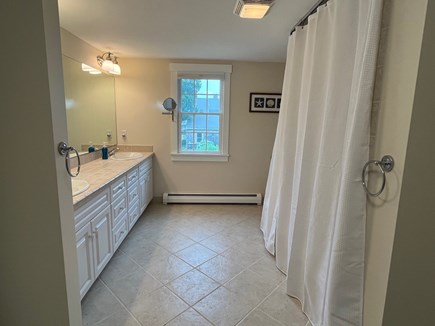 Dennis, Corporation Beach Cape Cod vacation rental - Second floor bathroom with double sinks and shower/tub.