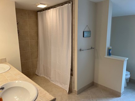 Dennis, Corporation Beach Cape Cod vacation rental - Second floor bathroom with double sinks and shower/tub.