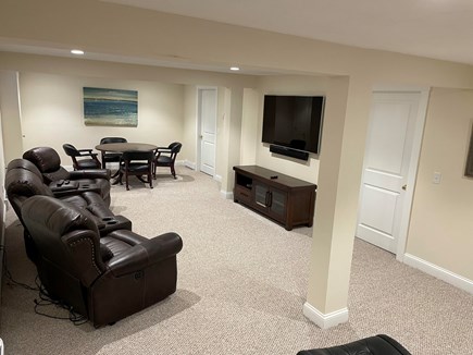 Dennis, Corporation Beach Cape Cod vacation rental - Finished basement with 60 inch TV, recliners and table for four
