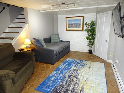 Brewster Cape Cod vacation rental - Downstairs living area with flatscreen TV, trundle bed