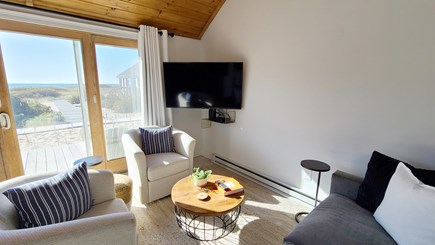 Truro Cape Cod vacation rental - Bright, open living room has comfortable seating & flat screen TV