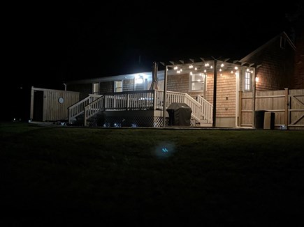 Sandwich Cape Cod vacation rental - Pergola in backyard lit up at night