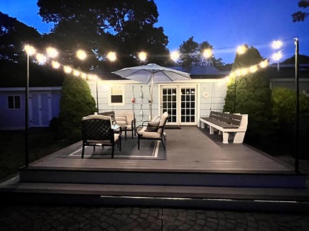 West Yarmouth Cape Cod vacation rental - Deck area at night with string lights.