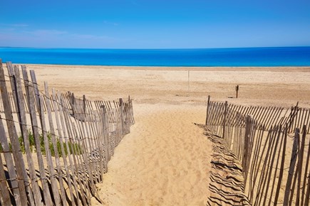 Barnstable Cape Cod vacation rental - A double fence leads to Sand Neck beach