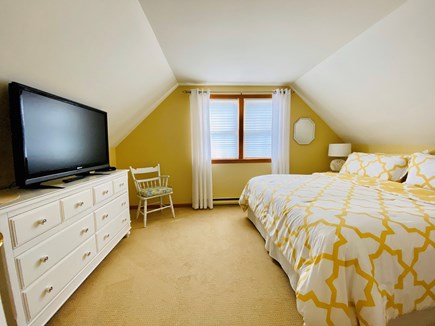 Brewster Cape Cod vacation rental - Primary Bedroom upstairs with a king-sized bed and a TV