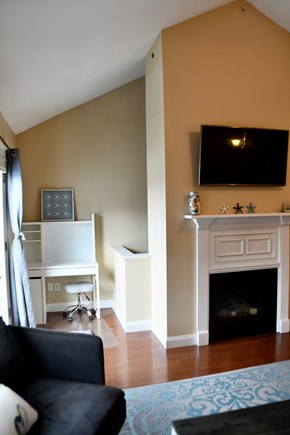 West Harwich Cape Cod vacation rental - Gas fireplace and desk area