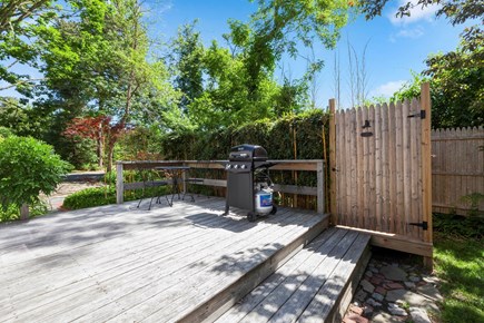 Dennis Port Cape Cod vacation rental - Deck with bistro table and outdoor shower and grill