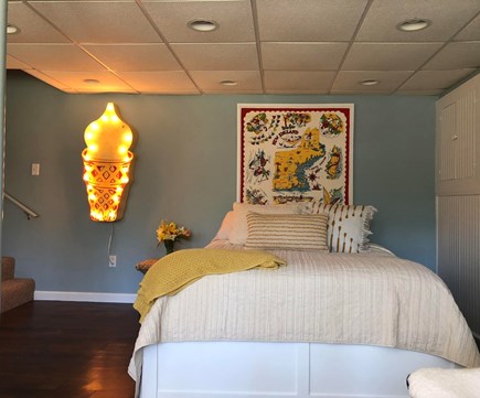 Brewster  Cape Cod vacation rental - Basement bedroom with vintage ice-cream sign.