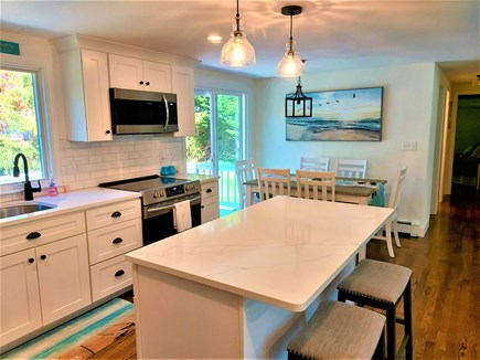Centerville Cape Cod vacation rental - Kitchen/Dining with Sliders to Deck