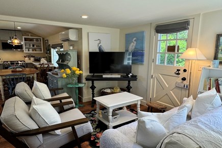 Barnstable Cape Cod vacation rental - Living area off of kitchen w/ cable TV