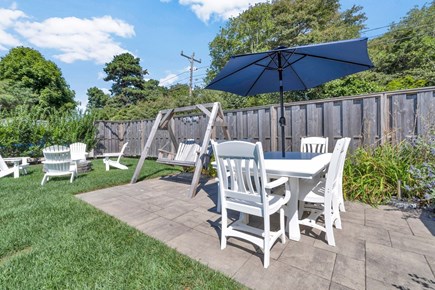 Barnstable Cape Cod vacation rental - Outdoor dining area, swing and fire pit