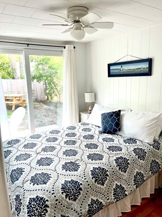Popponesset Cape Cod vacation rental - Bedroom #2- Queen bed with TV, closet and shelving space