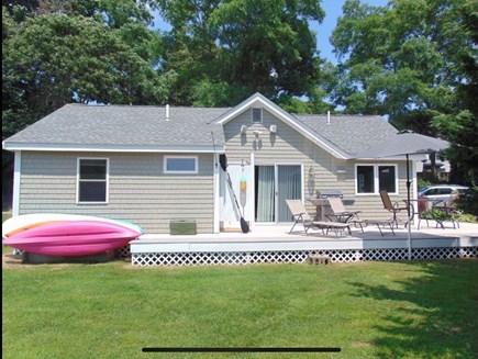 Eastham Cape Cod vacation rental - Deck with outdoor shower, gas grill, kayaks, & seating