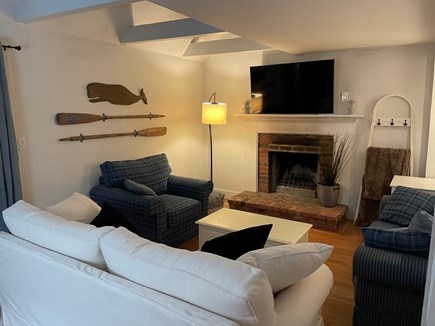 South Dennis Cape Cod vacation rental - Living room features cathedral ceilings, smart TV, and fireplace