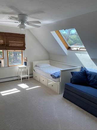 Eastham, Chloe's Classic Cape Cape Cod vacation rental - Twin bedroom also has a skylight with a shade, and a loveseat.