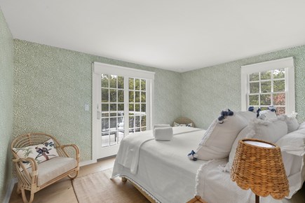 Massasoit Hills, Eastham, MA  Cape Cod vacation rental - First Bedroom with Queen Bed and Sliding Door to Deck