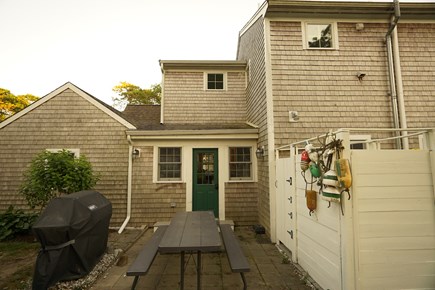 Dennis Cape Cod vacation rental - Backyard patio with BBQ gas grill, picnic table & outdoor shower