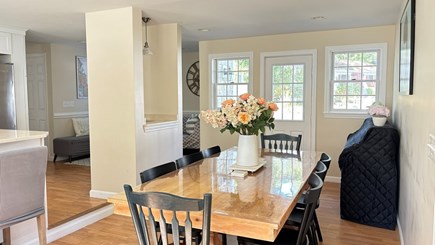 Dennis Cape Cod vacation rental - A large oak dining table for 8 people