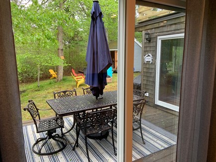 Popponesset-New Seabury Cape Cod vacation rental - Back yard & deck w/ iron dining table, outdoor shower, fire pit