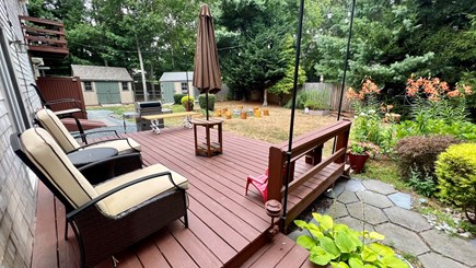 Centerville Cape Cod vacation rental - Back Yard with fire pit and patio furniture