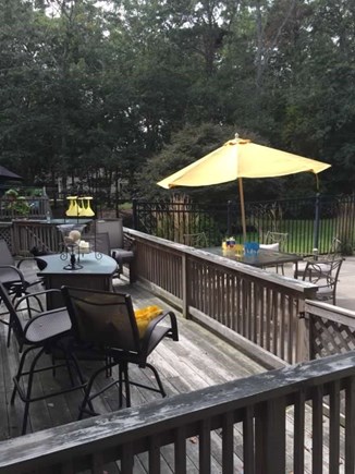 Barnstable Village, MA Cape Cod vacation rental - Pool area and separate deck with additional seating.