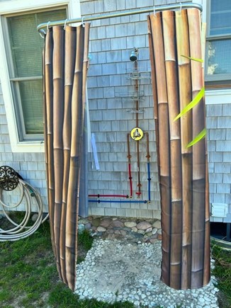 Plymouth, Priscilla Beach MA vacation rental - Outdoor shower with hot and cold water and beach stone floor.
