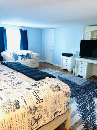 Yarmouth Cape Cod vacation rental - Main bedroom w/ king bed, leather loveseat and new window AC.