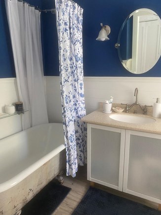 West Falmouth Cape Cod vacation rental - Downstairs master bathroom, refinished clawfoot tub with shower