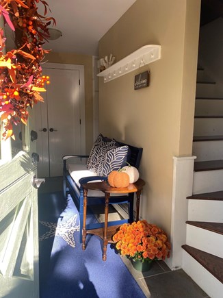 West Falmouth Cape Cod vacation rental - Front hall, full closet for storage, 1/2 bath and stairs to upper