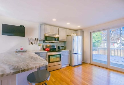 Mashpee Cape Cod vacation rental - Sliders off of kitchen onto deck