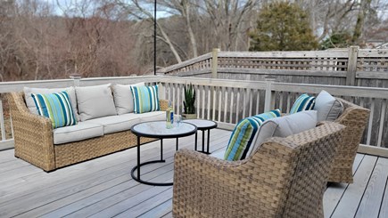 Centerville Cape Cod vacation rental - Large deck in backyard. Views of the lake from this sitting area.