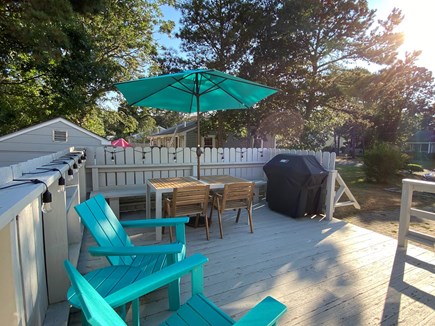 Dennis Cape Cod vacation rental - Deck with grill, table and Adirondack chairs.