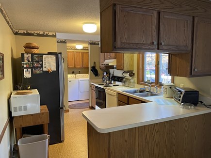 Wellfleet Cape Cod vacation rental - Another view of kitchen looking into laundry room