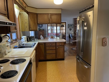 Wellfleet Cape Cod vacation rental - Kitchen has new stainless steel fridge, looking into dining room